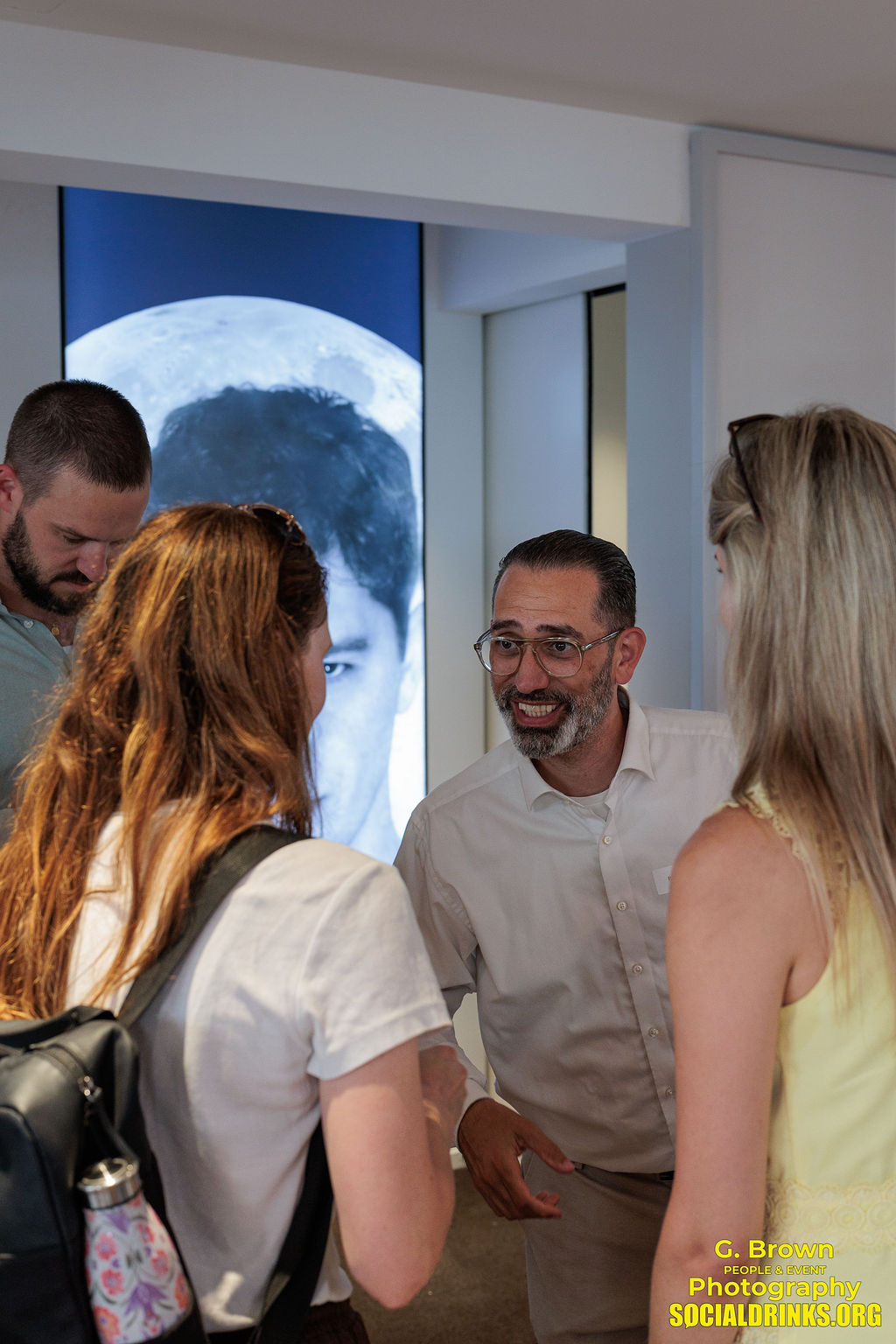 Guests enjoying a conversation at the Baschi × Oris event