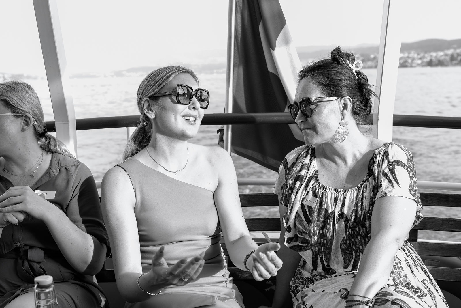 Guests sharing a laugh aboard the She Leads Tech boat event on Lake Zurich